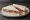 Sándwich de Miga de Jamón Crudo: an illustration of prosciutto, butter and mayonnaise on white bread.
