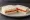Sándwich de Miga de Queso y Tomate: an illustration of cheese, tomato, butter and mayonnaise on white bread.