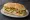 Sándwich de Pollo: an illustration of chicken, lettuce, tomato and mayonnaise on baguette.