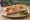 Sandwich du Bistrot: an illustration of ham, butter, pickle and gruyère on baguette.