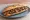 Sandwich Entrecôte: an illustration of beef, butter and onion on baguette.