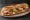 Sandwich Franc-Comtois: an illustration of gruyère, butter and pickle on baguette.