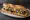Sandwich Gésiers Confits: an illustration of onion on baguette.