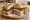 Sándwich Gourmet: an illustration of prosciutto, arugula, tomato, mozzarella and more on ciabatta.