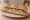 Sandwich Hareng-Pommes de Terre: an illustration of potato, onion, butter and scallion on baguette.