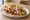 Sandwich Kebab: an illustration of lamb, lettuce, tomato, onion and more.