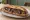 Sandwich Lamproie: an illustration of onion, garlic, butter and parsley on baguette.