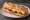 Sandwich Lorrain: an illustration of bacon, egg, gruyère and butter on baguette.