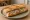 Sandwich Manceau: an illustration of butter and pickle on baguette.