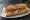 Sandwich Maquereau au Vin Blanc: an illustration of onion, carrot and butter on baguette.