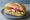 Sandwich me Kotopoulo: an illustration of chicken, lettuce, tomato, mayonnaise and more on bread.