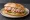 Sandwich me Tono (Τόνο): an illustration of tuna, mayonnaise, onion, lettuce and more on bread.