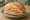 Sandwich me Tyri kai Zampon: an illustration of ham, cheese, butter and mustard on bread.