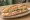 Sandwich Mixte: an illustration of ham, butter, lettuce, tomato and more on baguette.