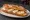 Sandwich Pélardon: an illustration of honey, olive oil and pepper on baguette.