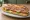 Sandwich Pique-Nique: an illustration of ham, butter, cheese, tomato and more on baguette.