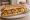 Sandwich Potée Auvergnate: an illustration of pork, cabbage, carrot, potato and more on baguette.
