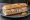 Sandwich Potjevleesch: an illustration of pork, chicken, veal, mustard and more on baguette.