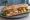 Sandwich Poulet Rôti: an illustration of chicken, butter, lettuce, mayonnaise and more on baguette.