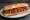 Sandwich Ratatouille: an illustration of eggplant, tomato, pepper, onion and more on baguette.