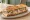 Sandwich Rillettes du Mans: an illustration of pork, pickle and pepper on baguette.