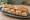 Sandwich Sainte-Maure-de-Touraine: an illustration of butter, honey and walnuts on baguette.