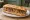 Sandwich Saucisse de Toulouse: an illustration of pork and mustard on baguette.