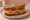 Sandwich Saumon Fumé: an illustration of salmon, cream cheese, dill and lemon on rye bread.