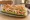 Sandwich Surimi-Crudités: an illustration of mayonnaise, lettuce, tomato and cucumber on baguette.