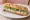 Sandwich Tartare Ail et Fines Herbes: an illustration of cheese, garlic and butter on baguette.