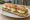 Sandwich Œuf Dur: an illustration of butter, egg, lettuce and tomato on baguette.