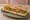 Sandwich Végétarien: an illustration of butter, goat cheese, cucumber, tomato and more on baguette.