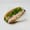 An open banh mi with sliced ham, pate, cucumber and cilantro in a paper-lined brown basket on a white background.