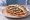 Sardeles se Pita (Σαρδέλες): an illustration of sardine, tomato, onion, lemon and more on pita.