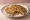 Sattu Paratha: an illustration of onion, pepper, cilantro, garlic and more on naan.