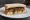 Sausage and Mash Sandwich: an illustration of butter on white bread.