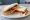 Sausage Butty: an illustration of butter, brown sauce and ketchup on white bread.