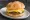 Sausage Egg and Cheese: an illustration of sausage, egg, american cheese and butter on kaiser roll.