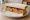 Sausage Roll Sandwich: an illustration of butter, brown sauce and ketchup on white bread.
