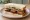 Sausage Sandwich (Texas BBQ): an illustration of sausage, beef, pork, jalapeño and more on white bread.