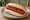 Saveloy Sandwich: an illustration of butter, brown sauce and ketchup on white bread.