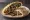Sawda Djej (سودا دجاج): an illustration of garlic, brown sauce, lemon, olive oil and more on pita.