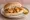 Scampi Butty: an illustration of butter, tartar sauce and lemon.
