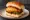 Schezwan Vada Pav: an illustration of potato, garlic, pepper, cilantro and more on bread.