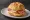 Schinken-Käse Brötchen: an illustration of ham, cheese and butter on kaiser roll.