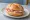 Schinkenbrötchen: an illustration of ham and butter on kaiser roll.