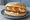 Scotch Egg Sandwich: an illustration of egg, sausage, pork, mayonnaise and more.