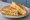 Scrambled Egg Sandwich: an illustration of egg and butter on white bread.