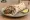 Seekh Kebab Roll: an illustration of onion, cilantro, pepper and yogurt on naan.