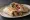Shawarma Arabi (شاورما عربي): an illustration of chicken, beef, lamb, garlic sauce and more on pita.